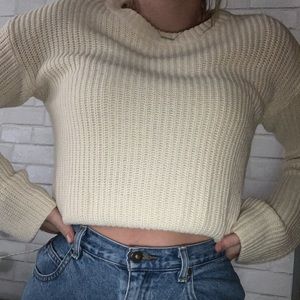 Cream/White colored sweater, with bow in the back